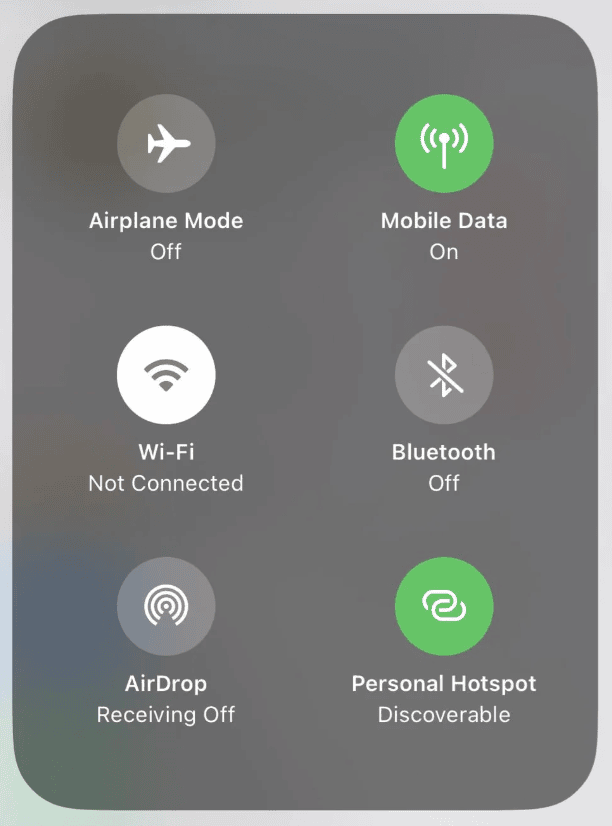 An iPhone Control Centre panel showing Personal Hotspot set to Discoverable, Bluetooth off, Wi-Fi not connected and AirDrop set to Receiving Off
