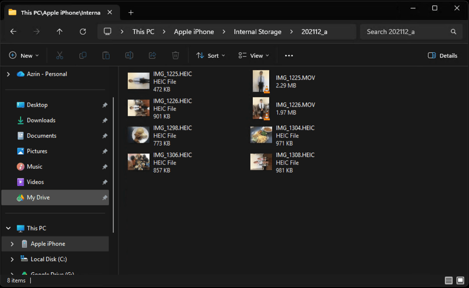 Windows File Explorer open at This PC, Apple iPhone, Internal Storage, showing iPhone HEIC photos and MOV videos ready to copy to the PC